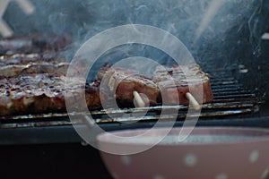 Traditional greek pork souvlaki being grilled on the barbecue