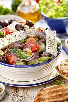 Traditional Greek salad consisting of fresh vegetables and  feta cheese