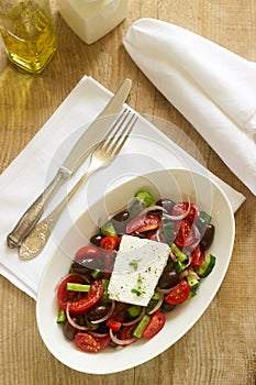 Traditional greek salad with fresh vegetables, feta cheese and olives.