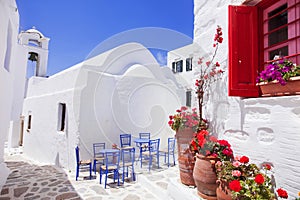 Traditional greek street with flowers in Amorgos island, Greece islands