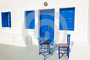 Traditional greek white architecture with blue doors and windows