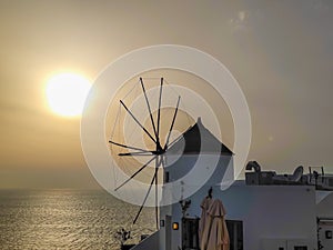 Traditional Greek windmill in Oia village on Santorini island, Greece