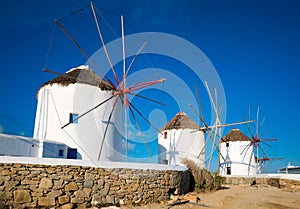 Traditional greek windmills on Mykonos island at sunrise, Cyclades, Greece