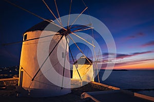 Traditional greek windmills on Mykonos island at sunrise, Cyclades, Greece