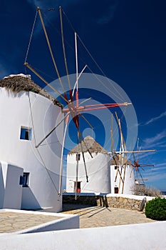 Traditional greek windmills on Mykonos island at sunrise, Cyclades, Greece