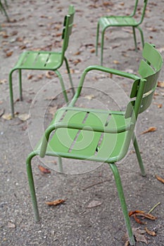 Traditional green chairs in the Tuileries garden. Paris