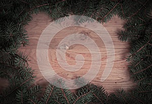 Traditional green Christmas wreath on wooden background