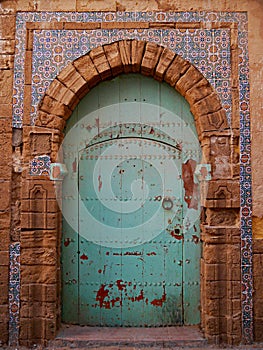 Traditional, green-painted Door with tiles, Essaouira, Morocco