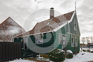 Traditional, green, wooden, Dutch house in the small village of Zaanse Schans