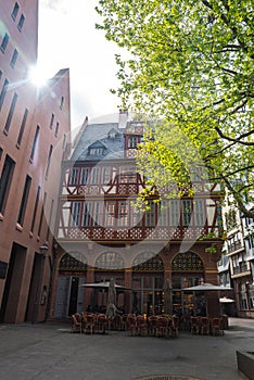 Traditional Half Timbered Building and Modern Brick Structure in Frankfurt photo