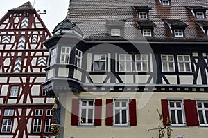 Traditional half-timbered houses on narrow medieval street in Rothenburg ob der Tauber, Bavaria, Germany. November 2014