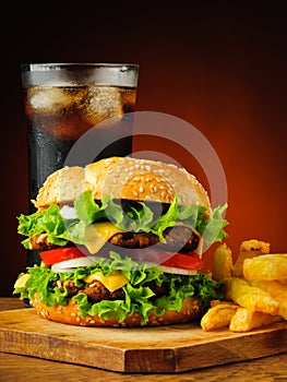 Traditional hamburger, french fries and cola drink