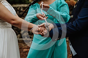 Traditional handfasting ceremony during the wedding