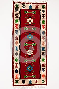 Traditional handicraft carpet with ethnic motifs