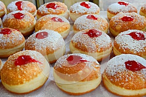 Traditional hanukkah sufganiyot with strawberry jelly