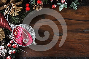 Traditional Happy Holidays and Christmas background with red and silver bauble.