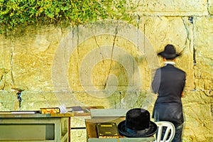 Traditional hat and a Jewish prayer in the Western Wall