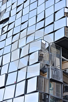 Traditional Haussmann Apartment Buildings Reflected in the Glassy Facade of a Modern High Rise in Paris, France