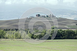 Traditional hilltop farm in Orcia valley, near Castelvecchio, Siena, Italy