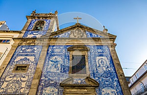 Traditional historic facade in Porto decorated with blue hand pa
