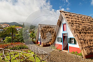 Traditional historic thatched houses with strawy roofs on Madeira island, Santana, Portugal photo