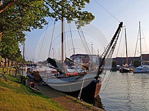 Traditional historical sailing ship in the harbor from Muiden in