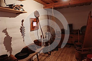 Traditional historical storage room of richer slovak peasant from 19th century. Hanged garlic on shelf.