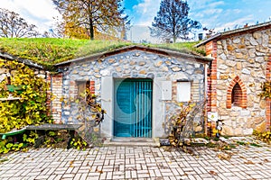 Traditional historical wine cellar at Vrbice village, South Moravia region - Czech Republic. Small wine houses with plants over photo