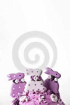 Traditional holiday Easter cakes decorated with lilac bunnys. Greeting card