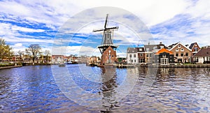 Traditional Holland -canals and windmills (Haarlem) photo