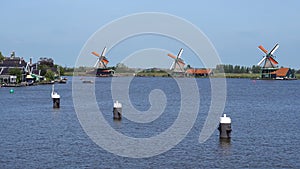 Traditional Holland Windmills in Zaanse Schans, Netherlands. Touristic Village near the Amsterdam with the windmills and