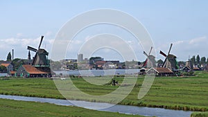 Traditional Holland Windmills in Zaanse Schans, Netherlands. Touristic Village near the Amsterdam with the windmills and