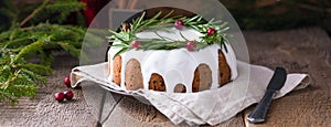 Traditional homemade Christmas fruit cake on the wooden background, banner