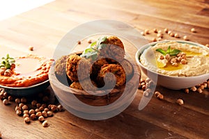 Traditional homemade hummus, falafel and chickpea on rustic table. Jewish Cuisine