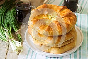 Traditional homemade Romanian and Moldovan pies - Placinta, served with wine. Rustic style.