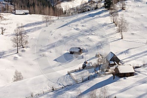 Traditional homes in Romania ,Transylvania winter in Carpathian mountains landscape