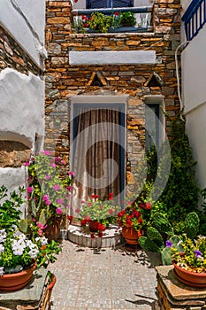 Traditional house with colorful flowers in Kythnos cycladic island in Greece