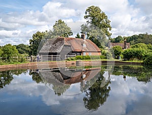 Traditional house is situated near a tranquil pond in Burwash, United Kindom