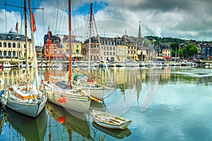 Traditional houses and boats in the old harbor, Honfleur, France