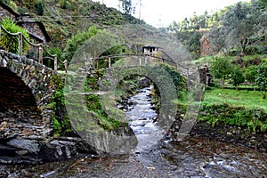 Traditional Houses and Bridges at Foz de Egua, near Piodao, remote village in Central Portugal photo