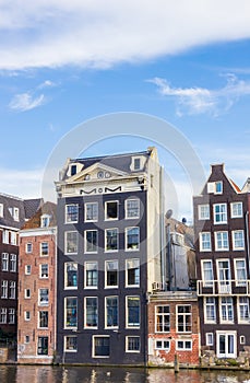 Traditional houses at the Damrak in Amsterdam