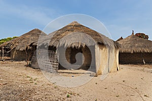 Traditional houses huts in the village of Eticoga in the island of Orango, Guinea Bissau photo