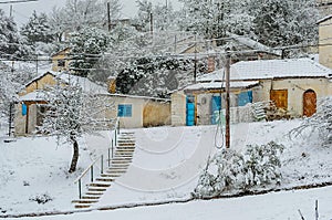 Traditional Houses in a Snow Covered Village in a Greek Mountain During Heavy Snowfall on Winter Season