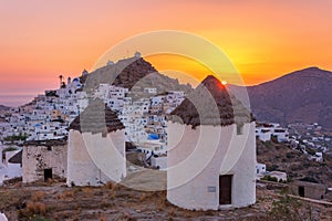 Traditional houses, wind mills and churches in Ios island, Cyclades.