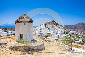 Traditional houses, wind mills and churches in Ios island, Cyclades.