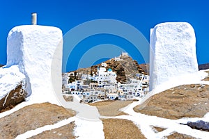 Traditional houses, wind mills and churches in Ios island, Cyclades.