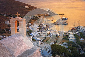 Traditional houses, wind mills and churches in Ios island, Cyclades, Greece.