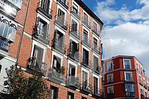 Traditional housing buildings in Chueca district in Madrid, Spain photo