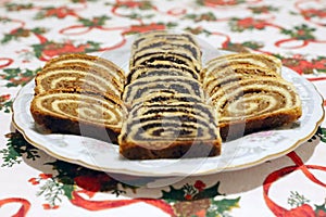 Traditional hungarian christmas sliced rolled cakes on table