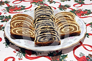 Traditional hungarian christmas sliced rolled cakes on table